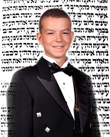 The backdrop is his actual Torah portion, photographed from the Torah that he will read from.
